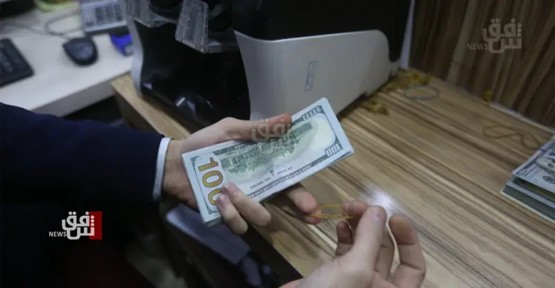 شفق نيوز..خبير: العراق يهدم مبرر تغيير سعر الدولار بالاقتراض من النقد الدولي
